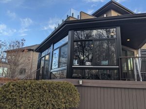 Review page picture Another fine black curtain wall, enclosing a covered deck is by far the most cost effective way to add living space to your house
